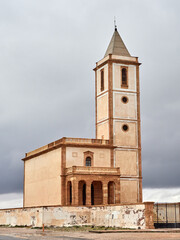 Obraz premium Christian temple surrounded by mountains and salt is located on the beach of Las Salinas, in Cabo de Gata. It has been the setting for numerous series, films, TV shows, music, videos. 