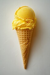 Single Scoop of Creamy Yellow Ice Cream in a Crispy Waffle Cone on a Light Background for Refreshing Treats and Summery Delights