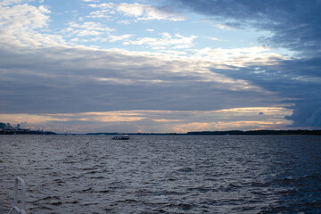 sunset in a cloudy sky on the river