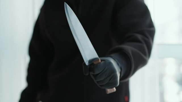 A man with a sharp and large knife in his hands.
Criminal with a sharp knife.
Long knife blade.
Serial killer with a knife.
Domestic violence.
Cut, blade, knife, kitchen, conflict