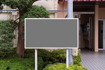 Large blank billboard on a street wall, banners with room to add your own text