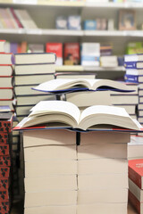 stack of books on the table. open book