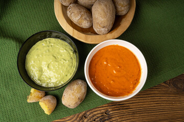 Red mojo rojo and green mojo verde sauces, traditional Tenerife dips, mojo picon dressing