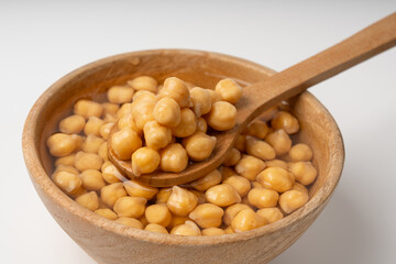 Soaked chickpeas, chick pea in water, swollen wet Cicer arietinum fruits, garbanzo beans cooking