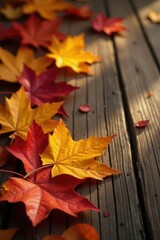Obraz premium Warm and richly colored autumn leaves scattered on a wooden table, autumn, leaf fall, fall leaves