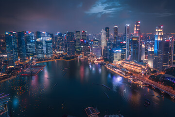 A dazzling, night-time panorama of Singapore's bustling cityscape and local attractions