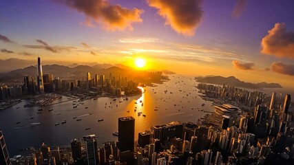 Aerial hyperlapse captures stunning sunset over Victoria Harbour in Hong Kong, 4k aerial hyperlapse video of Victoria Harbour in Hong Kong at sunset