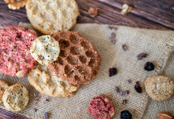 Oat cookies with  nuts and seeds on shadows background