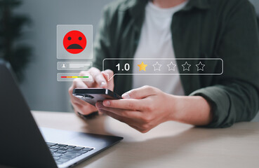 Customers choose a 1-star rating in a survey on a virtual touchscreen on a smartphone and their...