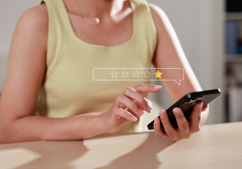 Customers choose a 1-star rating in a survey on a virtual touchscreen on a smartphone and their...
