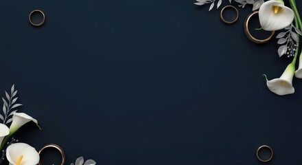 Elegant wedding rings with white calla lilies on dark background