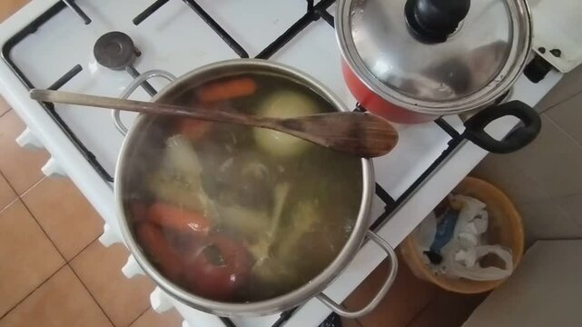 good chicken broth boiling in the pot
