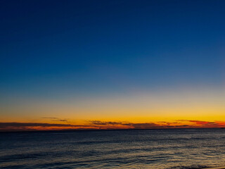 Deep Blue Sky and Ocean Horizon at Dusk
