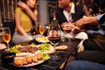 waiter serving wine in restaurant