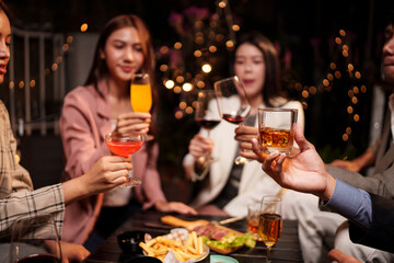 young couple celebrating with champagne at night