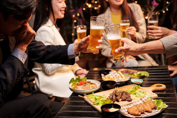 young people having dinner in restaurant