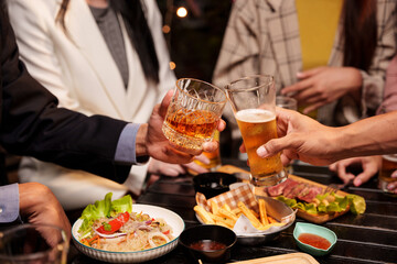 waiter serving tray of wine