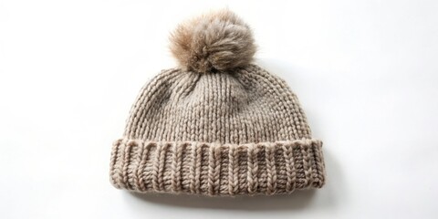 A luxuriously soft, hand-knitted beanie with a fluffy pompom, perfect for winter warmth and style