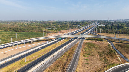 Drone shot aerial view of high angle view of intersection across the bridge against the countryside highway