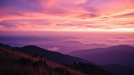 Fototapeta premium Ethereal sunset illuminates the distant mountain ranges.