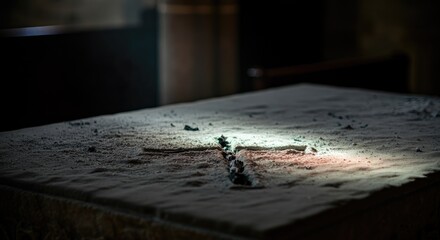 Light shining on dusty altar in dimly lit room