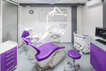 Modern Dental Clinic Interior with Stylish Purple Design and Advanced Equipment for Comprehensive Oral Health Care and Patient Comfort