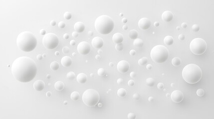 A collection of white spheres of varying sizes scattered across a white background.