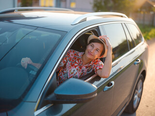 Traveler woman drives car through scenic countryside of Croatia