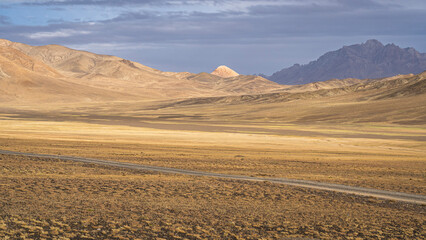 Colorful high altitude mountain landscape along Pamir Highway on summer late afternoon, Murghab, Gorno-Badakhshan, Tajikistan