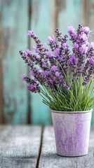 Fototapeta premium Lavender bouquet in vintage pot on wood