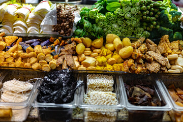 Traditional Asian dishes sold in a food court in Singapore