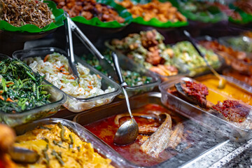 Traditional Asian dishes sold in a food court in Singapore