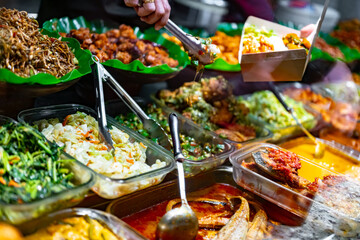 Traditional Asian dishes sold in a food court in Singapore