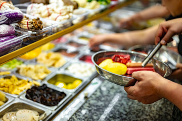 Traditional Asian dishes sold in a food court in Singapore