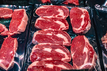 Meat products put up for sale in a commercial refrigerator