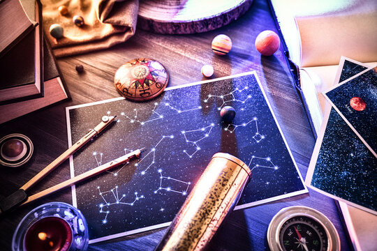 Ancient astrology study with retro objects on wooden table detail