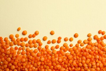 Red lentils on color background