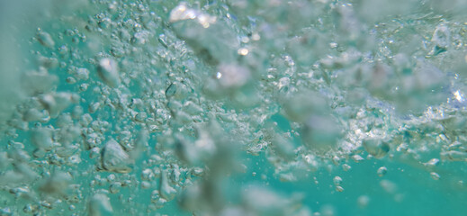 Underwater Air Bubbles in Turquoise Ocean Capturing Movement and Vitality