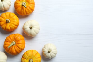 Beautiful autumn composition with pumpkins on a white background, top view