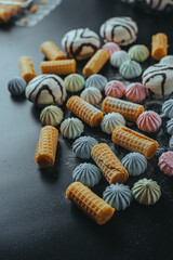 Colorful Marshmallows and Wafers on Dark Background