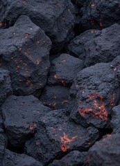 a close up of coal with red and orange flames. Glowing Volcanic Rocks