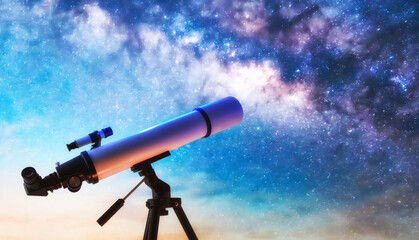 Telescope on tripod pointing at a starry sky at dusk