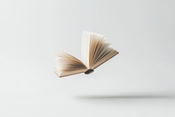 Open Book Floating on White - An open book floats against a clean white background, symbolizing knowledge, learning, imagination, freedom, and potential