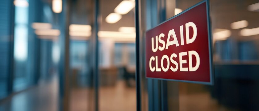 usaid Closed Sign on Glass Door
