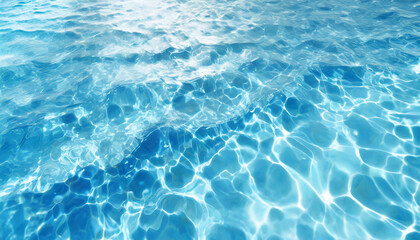 Blue soft blurred water waves surface ripples. Defocus blurred transparent blue colored clear calm water surface texture with splash and bubbles. Water waves with shining pattern texture background.
