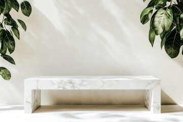 White marble bench with plants and sunlight.