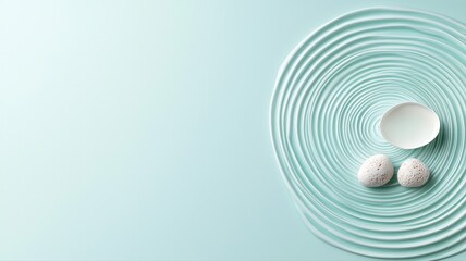 Minimalistic design with round white objects on textured surface, creating a balanced visual effect.