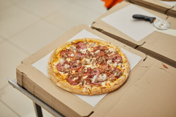 a professional chef assembles and cooks a delicious pizza.