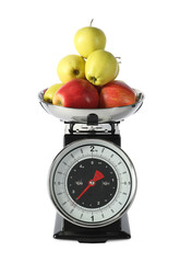 Retro mechanical kitchen scale with apples isolated on white