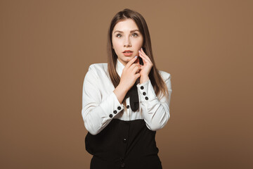 Photo of a Young Beautiful Brunette with Toothache and the Need for Dental Care. Attractive Woman Expressing Dental Discomfort. Concept of Tooth Pain, Oral Health, Displeasure, and Dental Issues